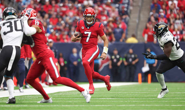 Nov 26, 2023; Houston, Texas, USA; Houston Texans quarterback C.J. Stroud (7) runs with the ball during the second quarter against the Jacksonville Jaguars at NRG Stadium. Mandatory Credit: Troy Taormina-USA TODAY Sports